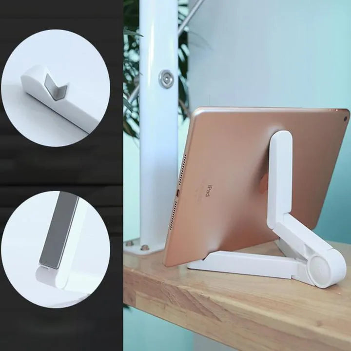 Black foldable tablet holder displaying adjustable angles with phone in landscape mode on non-slip surface