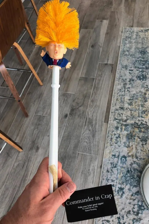 Yellow plastic Donald Trump novelty toilet brush with hanging handle, 40cm long