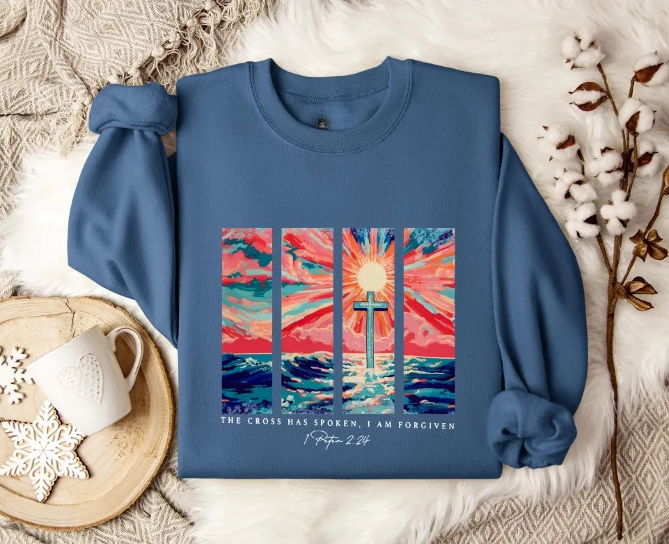 Blue plus size drop-shoulder printed pullover sweater on a hanger