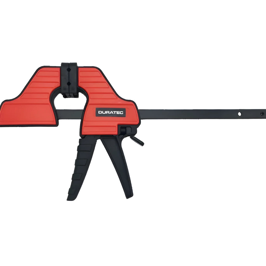 Black plastic one-handed ratcheting woodworking clamp with a quick-release trigger and soft rubber protective grips.