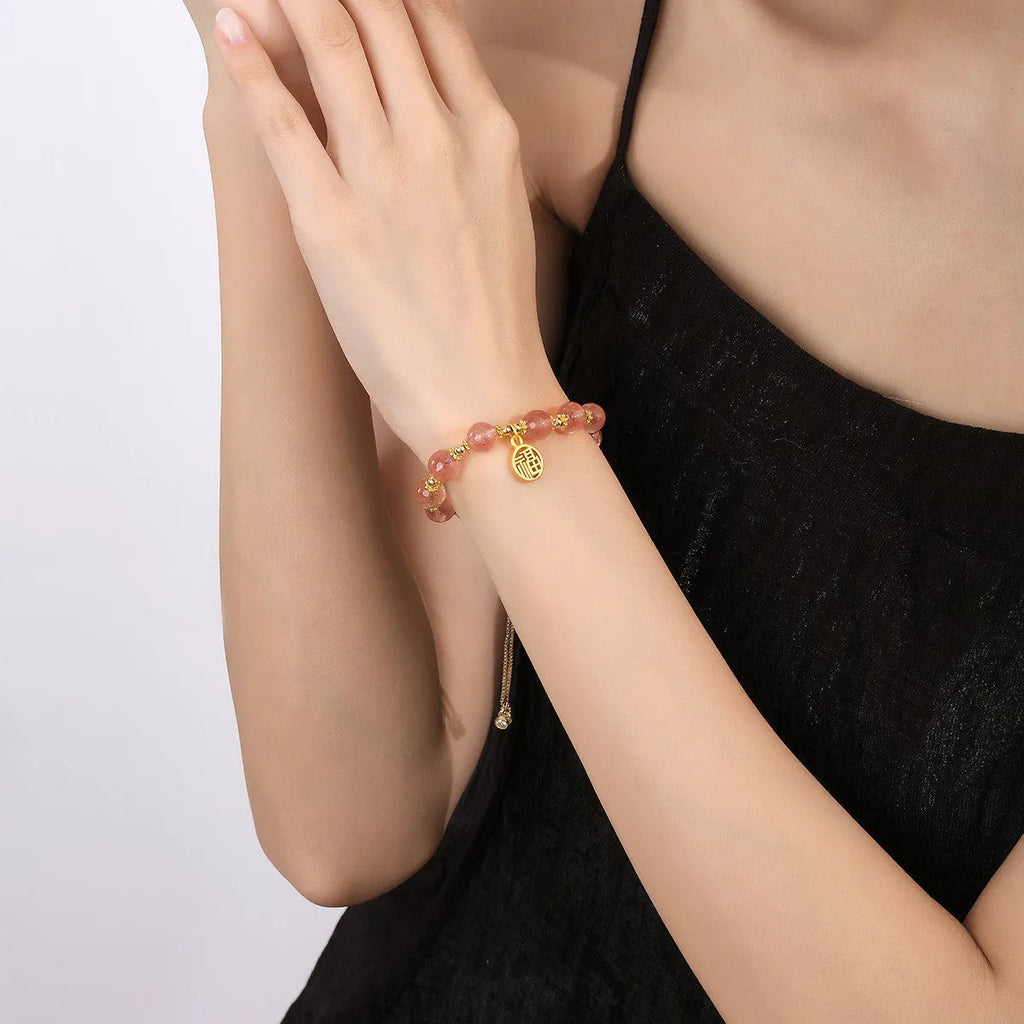 Strawberry quartz crystal bracelet with geometric shapes and fu charm for women