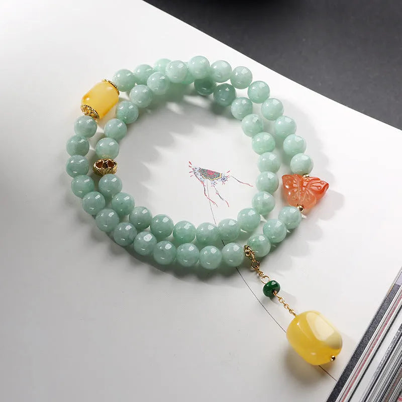 Double-layer women's bracelet with jade round beads and beeswax barrel beads in geometric hanging design