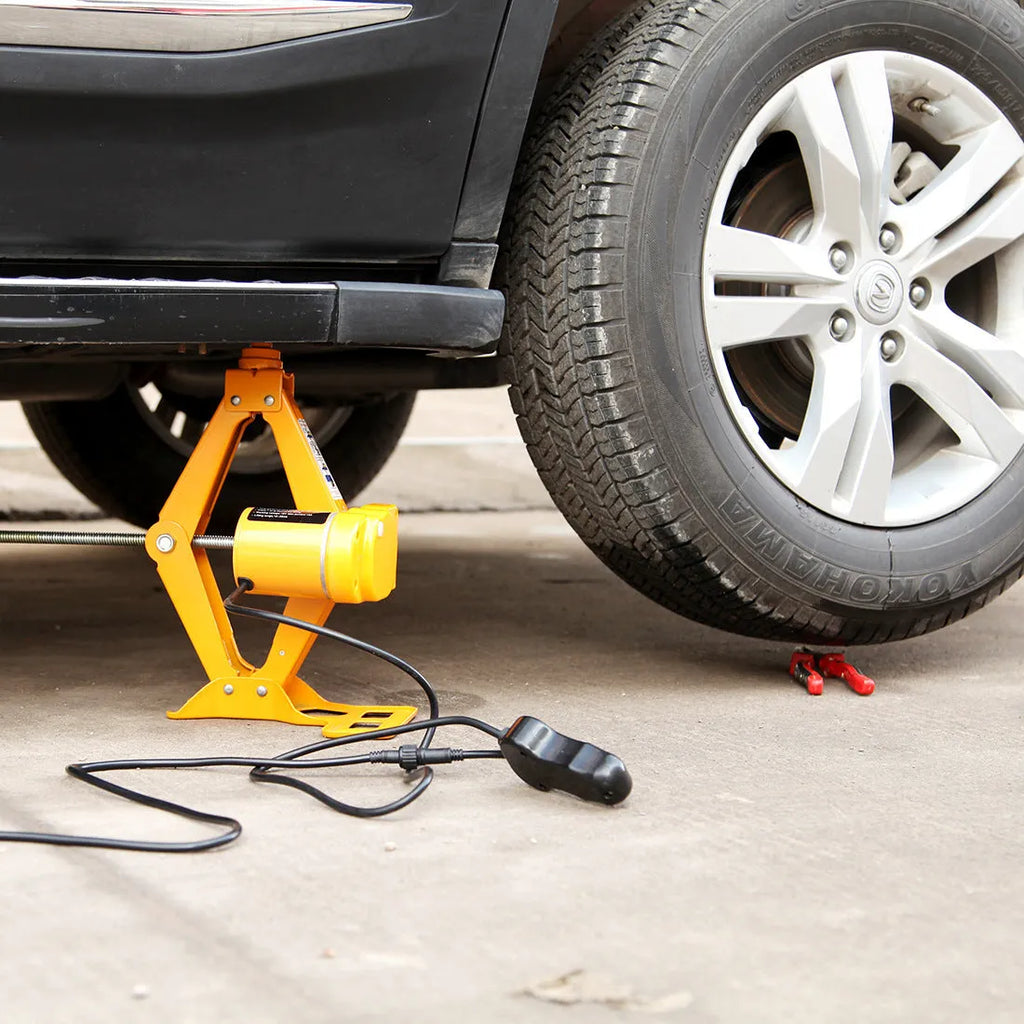 Electric hydraulic car jack with control unit showing 2-ton capacity and height adjustment