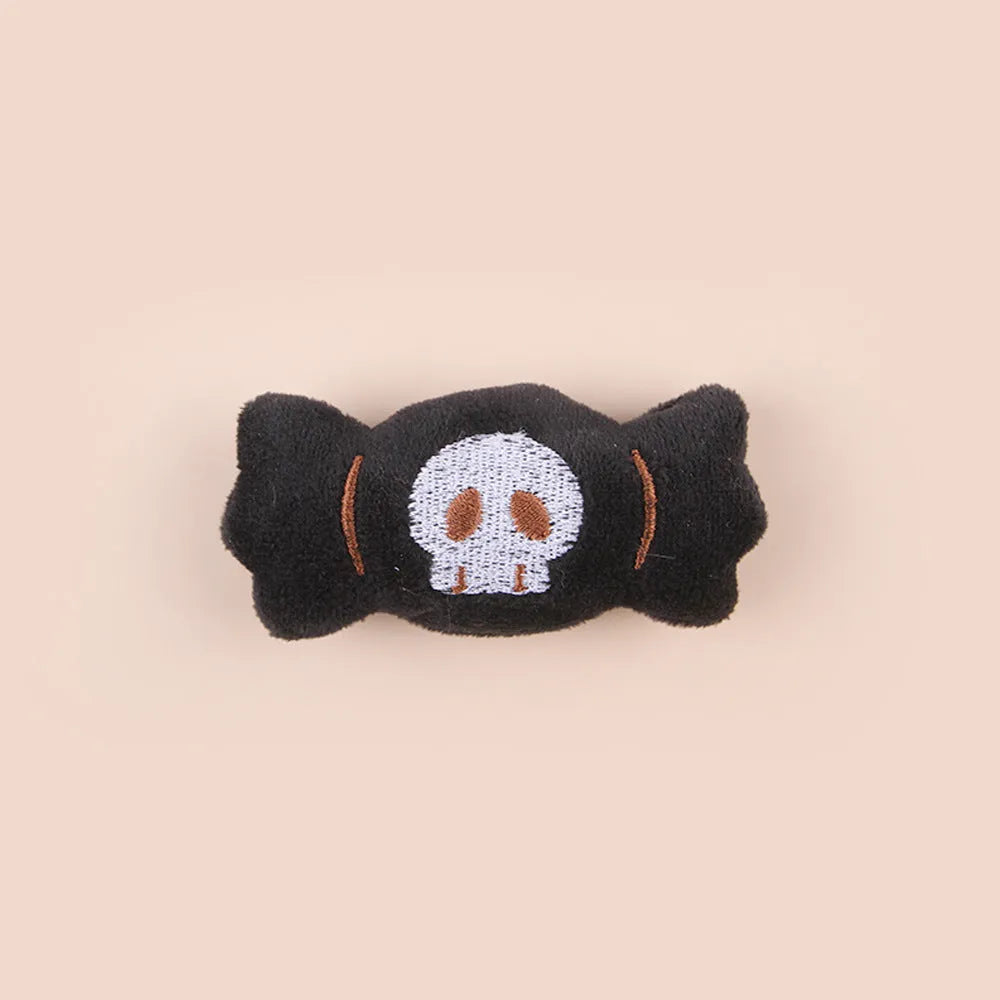 Plush cat teaser toy with feather wand in candy or skull design for small cats