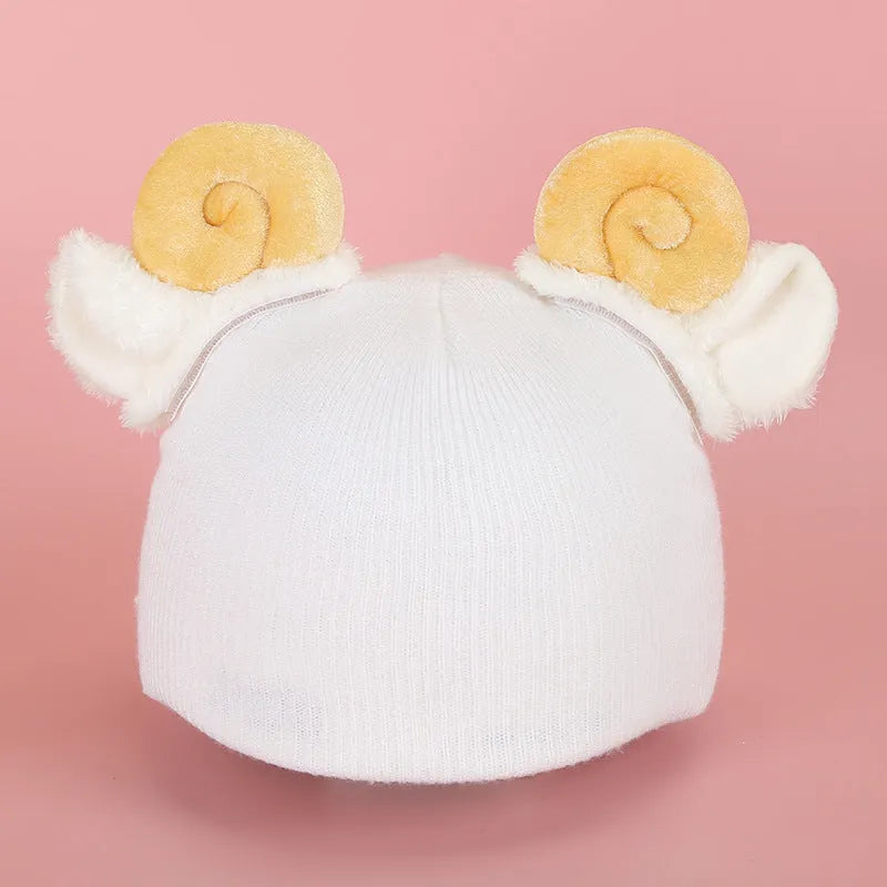 Plush cartoon-themed cover set on a medium motorcycle helmet with soft ear decorations.
