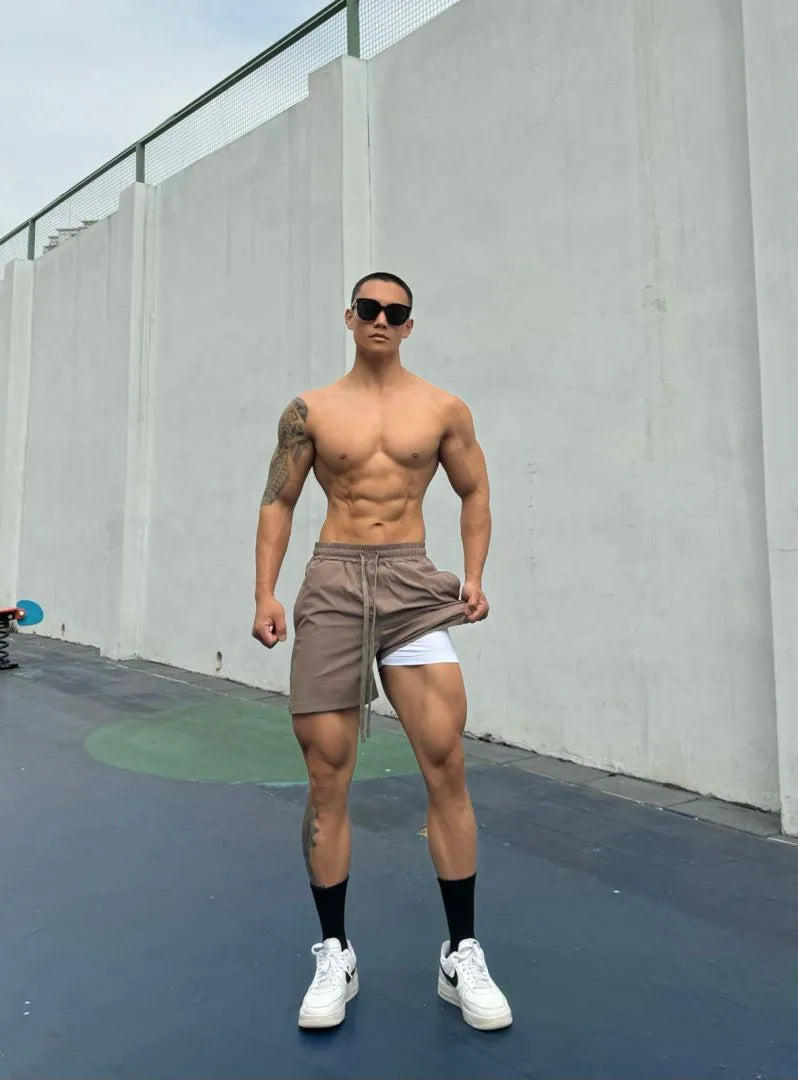 Men's ice silk quick-drying double-layer casual shorts in light grey.