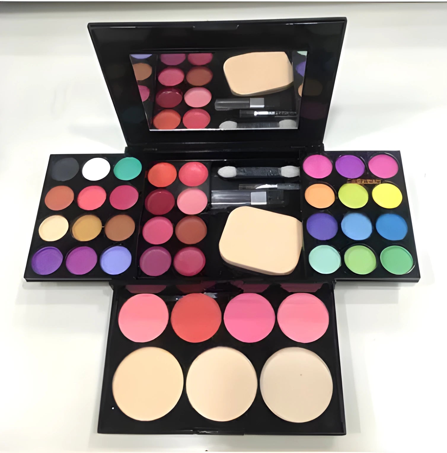 Three-layer makeup box with 24 colour eyeshadows, 8 lipsticks, blushes, powders, brushes, and mirror