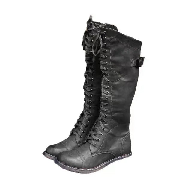 Chunky heel high leg boots in black colour with round toe and low heel