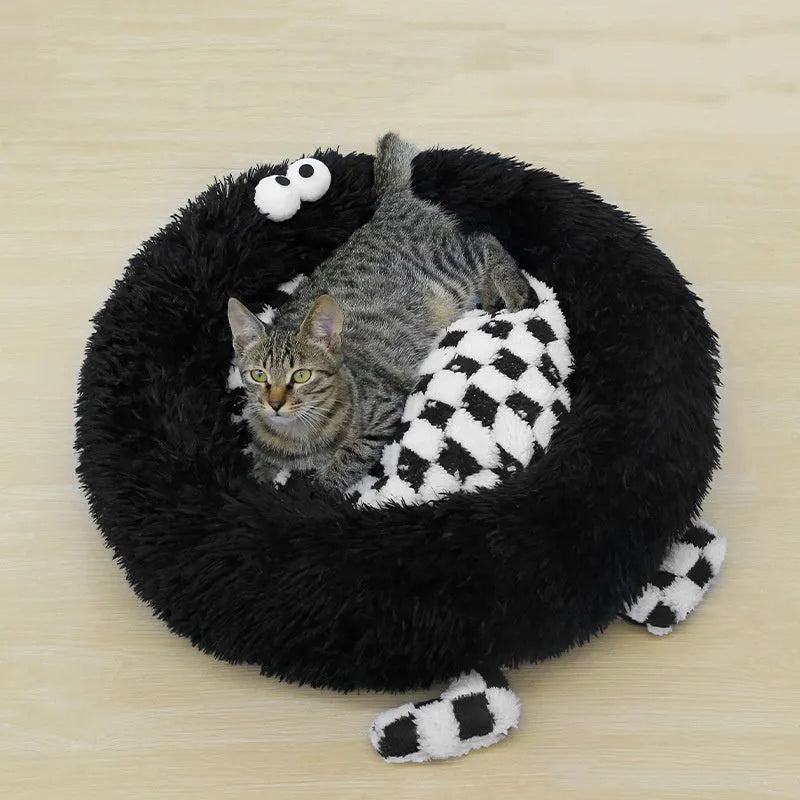 A plush, thick nest-style dog bed for small to medium sized pets, shown in yellow, pink, or black.