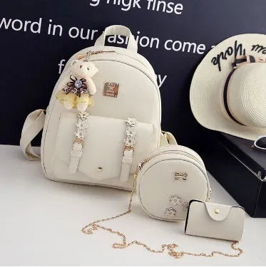 Three-piece PU leather backpack set for teenage girls in four colours with floral detailing