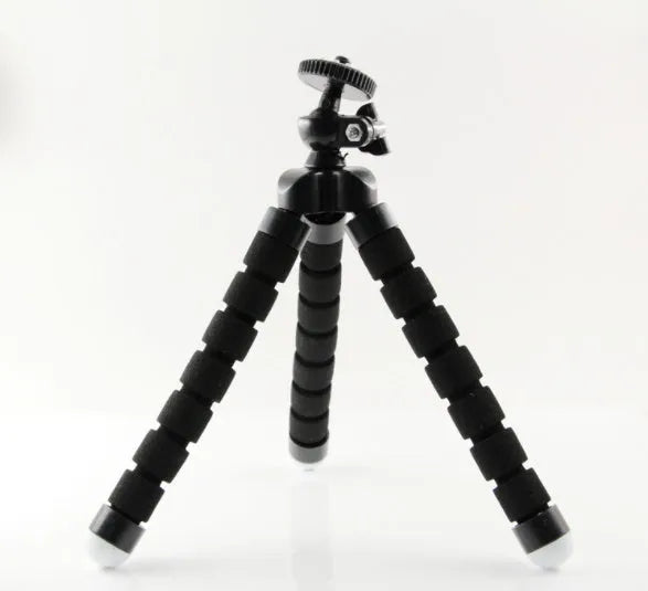 Black flexible octopus tripod wrapped around pole holding smartphone for video recording