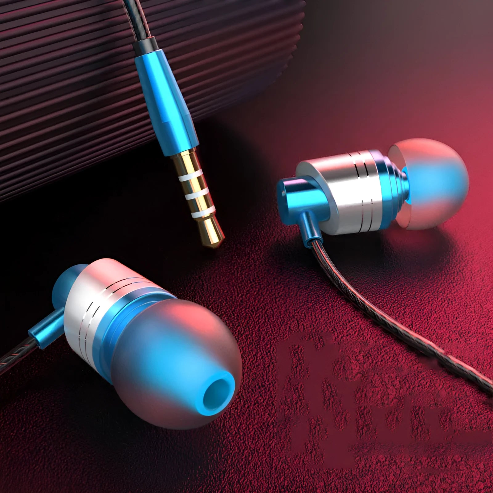 Black wired in-ear headphones with a 3.5mm plug, built-in microphone on cable, and silicone ear tips.