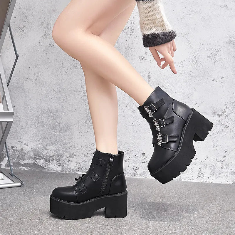 Black women's punk gothic ankle boots with bat buckle, side zipper, and chunky platform heel.