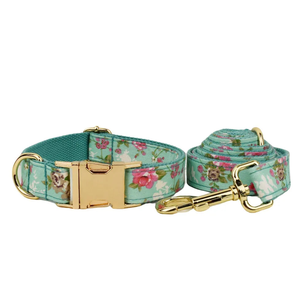 Rose print fabric dog collar set with green detachable bow, leash, and vest for pets