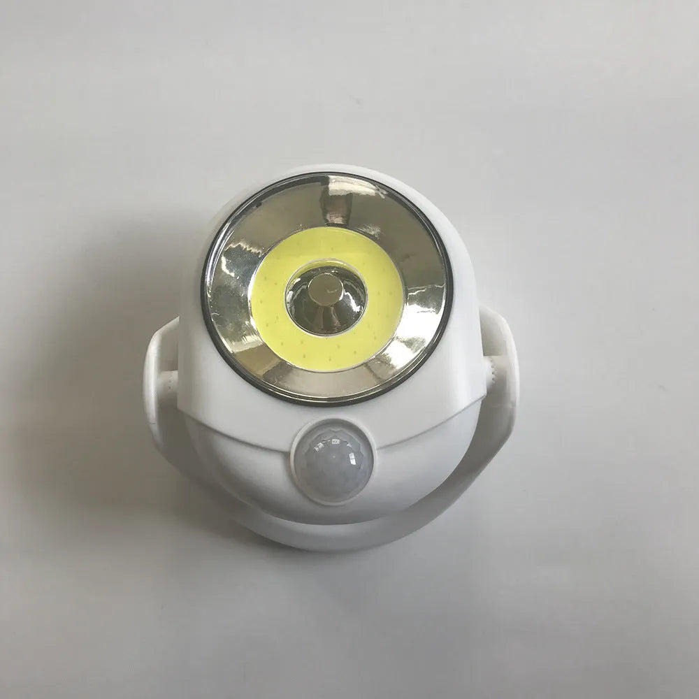 White Atomic Angel induction lamp measuring 13.3 cm with touch activation