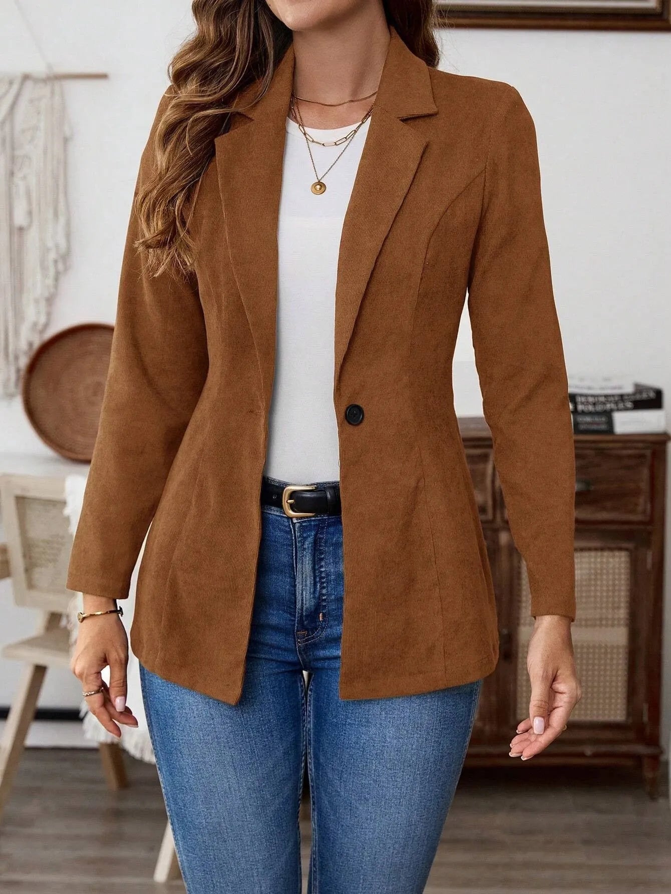Brown single-breasted men's leisure suit coat with lapel collar and long sleeves.