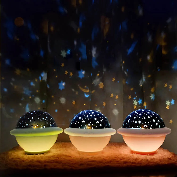 Green UFO shaped starry sky projection night light on a surface showing star projection.