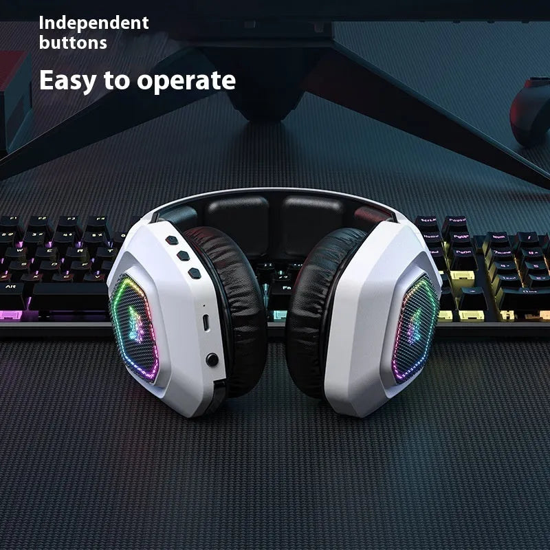 Black and white wireless gaming headset with RGB lighting showing 2.4G receiver and charging cable