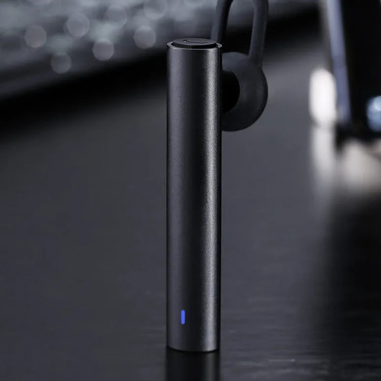 Compact black and white wireless Bluetooth earpiece showing 5.6 cm size dimensions