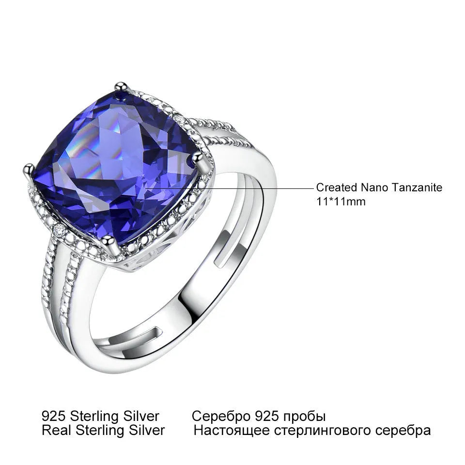 Close-up of a sterling silver ring with a blue tanzanite gemstone.