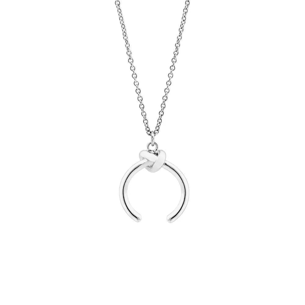 Geometric pendant necklace on an adjustable cross chain, shown in gold and silver electroplated finishes.