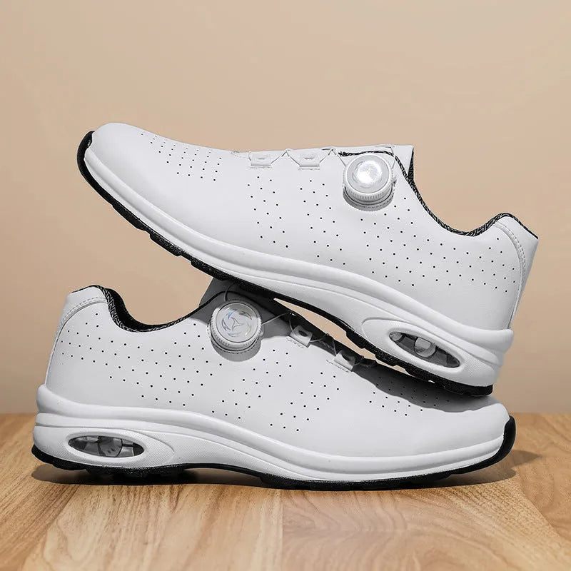 Men's black and white low-top mesh casual tennis shoes with lace-up front and cross straps.