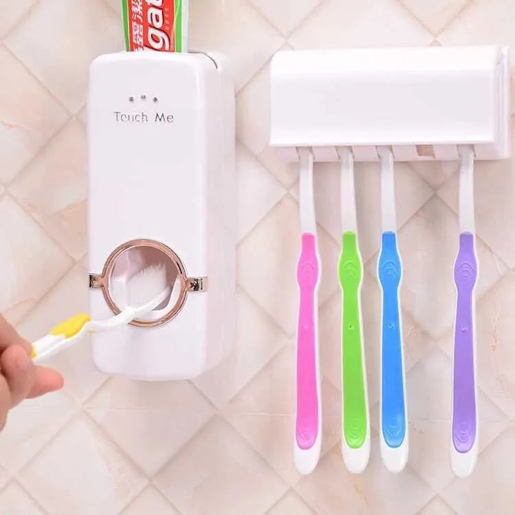 White adhesive wall-mounted toothbrush holder with pump on a bathroom tile.