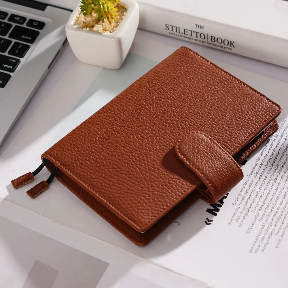 A6 size leather loose-leaf diary with a textured lychee pattern cowhide cover