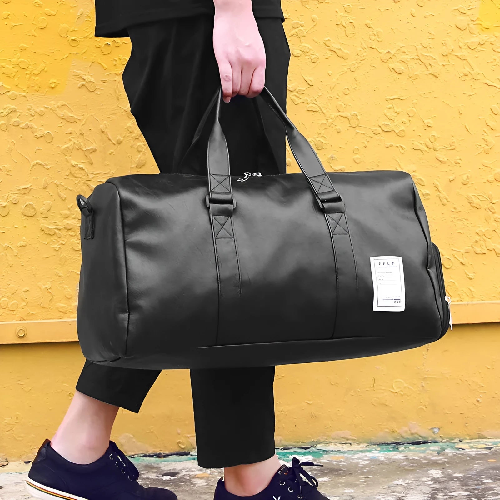 Black waterproof sports duffel bag with two side shoe compartments and diagonal straps, shown in large and small sizes.