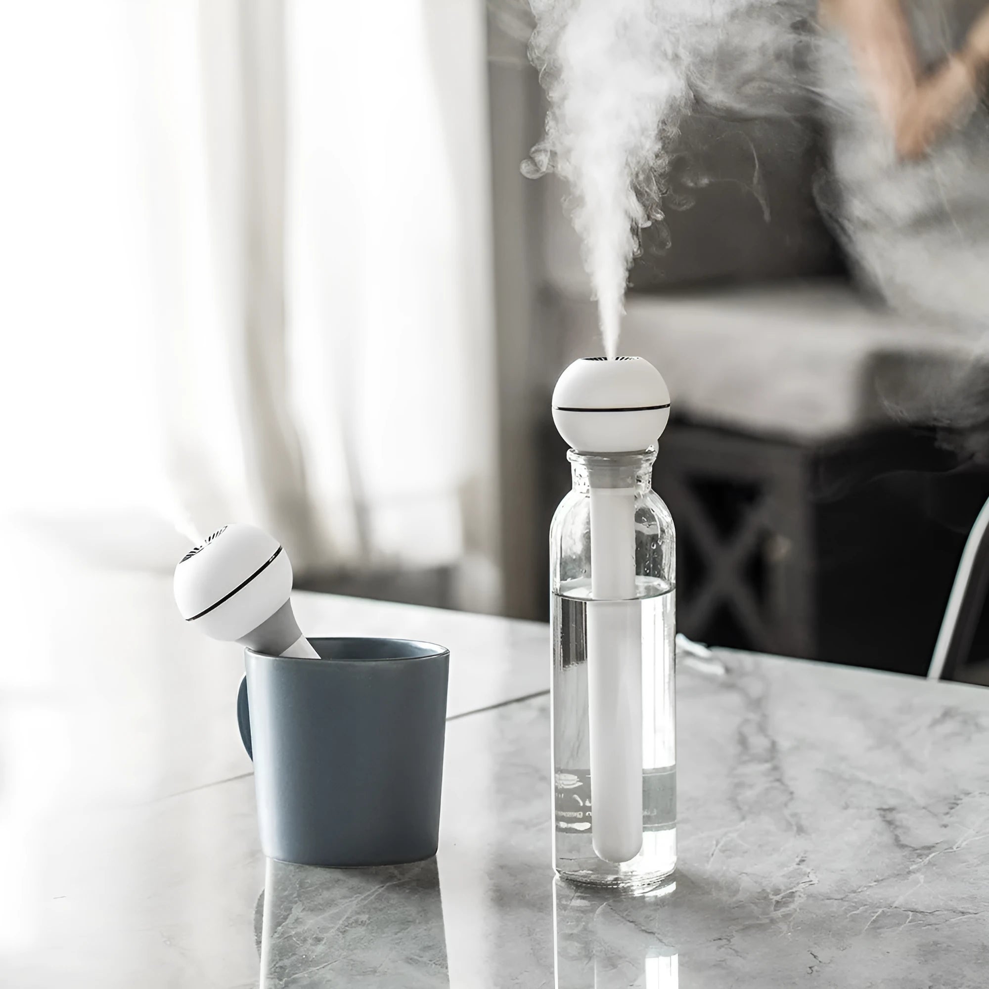 Columnar magic wand humidifier in pink or white with USB power cable