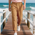 Men's linen casual trousers in a straight-leg style with drawstring waist, shown in a summer colour option.