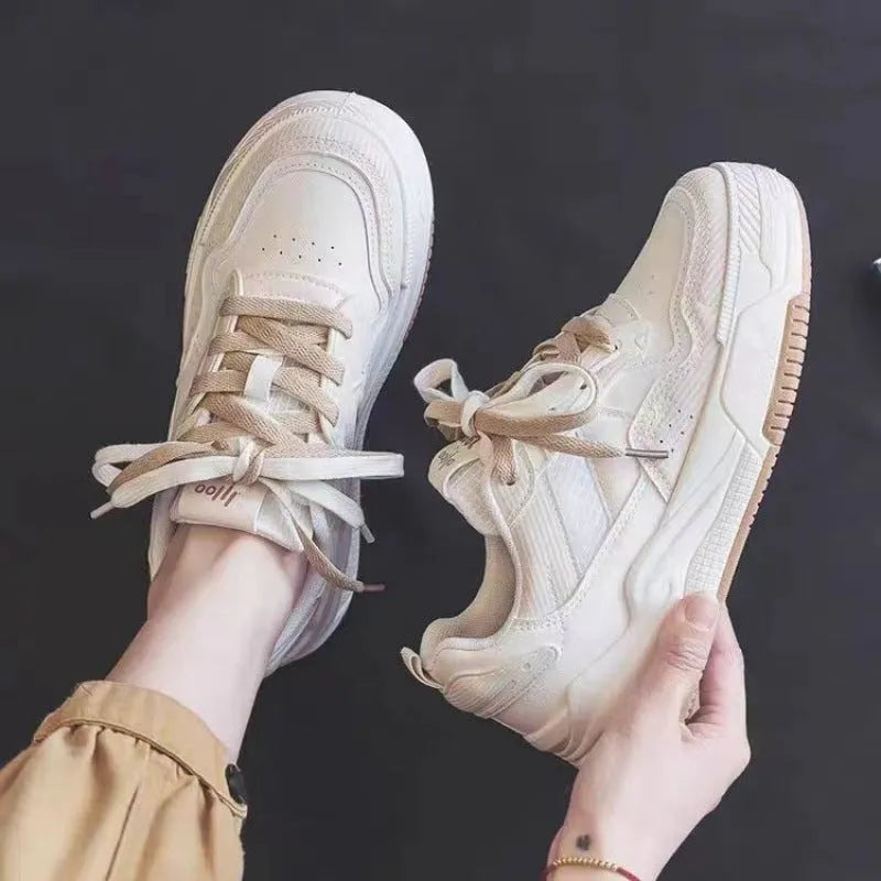 Spring low-top sneakers with rubber sole in beige and pink colour options on a white background