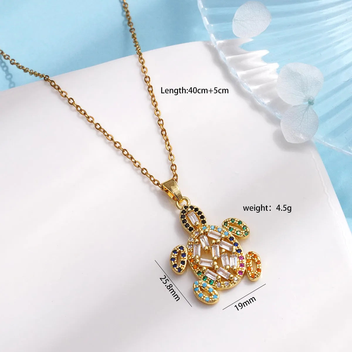 Gold-plated copper sea turtle pendant necklace with mixed gemstone inlay and zirconium encrustation on titanium steel chain