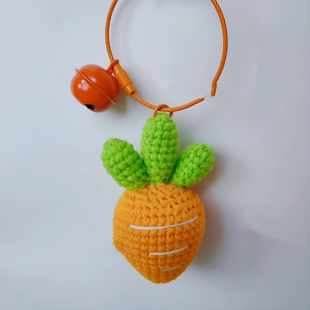 Soft wool cartoon carrot shaped keychain pendant on a keyring.