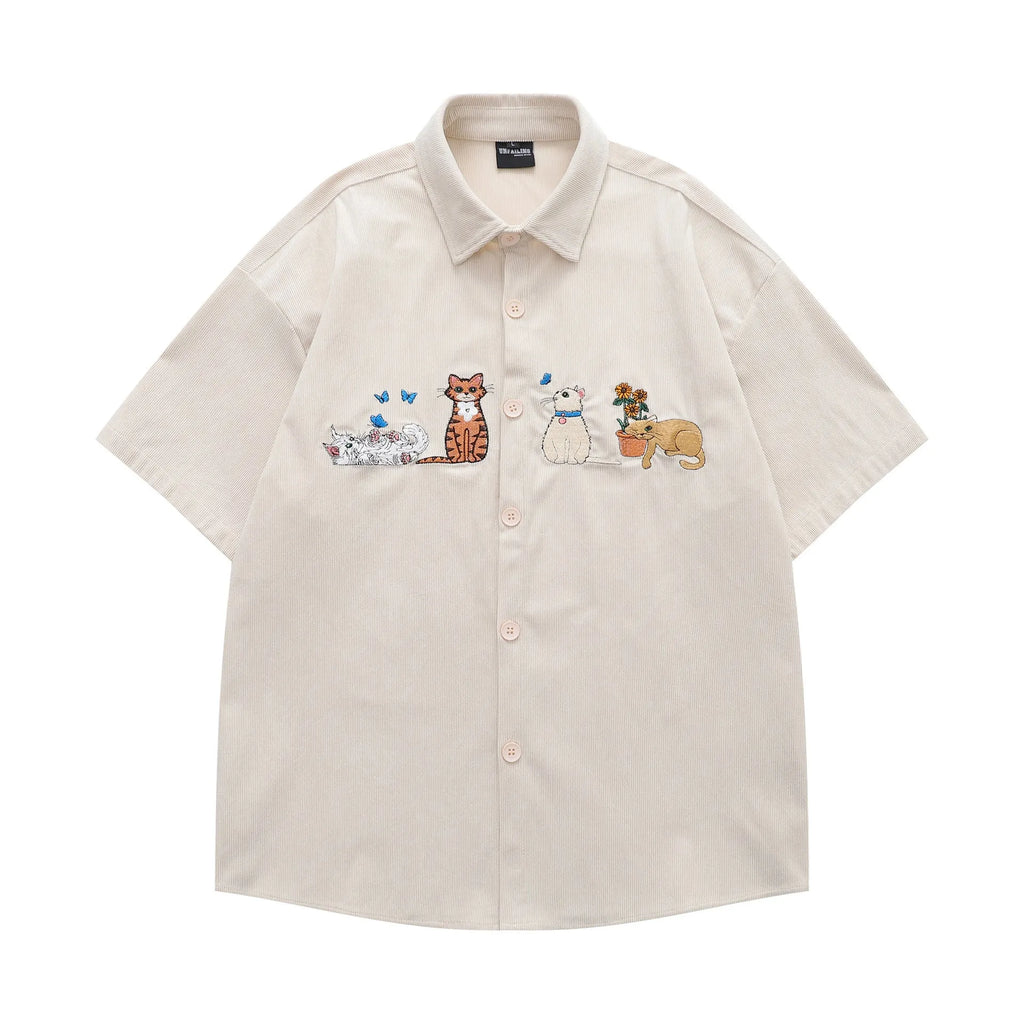 Loose cardigan shirt with cartoon embroidery in apricot colour, loose fit design