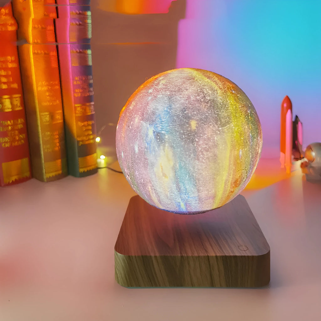 Square walnut coloured levitating moon lamp with galaxy design hovering above a circular base.