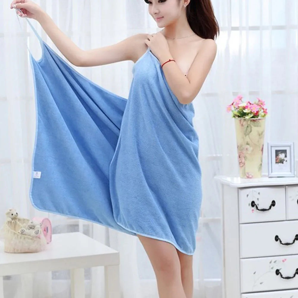 Lightweight microfiber beach towel dress shown in blue, worn as a cover-up at the beach.