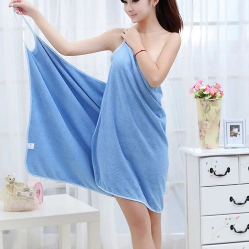 Lightweight microfiber beach towel dress shown in blue, worn as a cover-up at the beach.