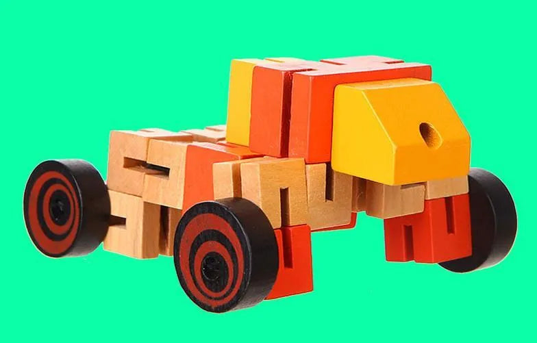 Wooden robot 3D puzzle pieces in blue, green, orange red, and red colours on a table
