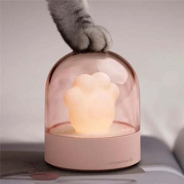 Grey and pink cat paw shaped night light with USB charging port and music box functions