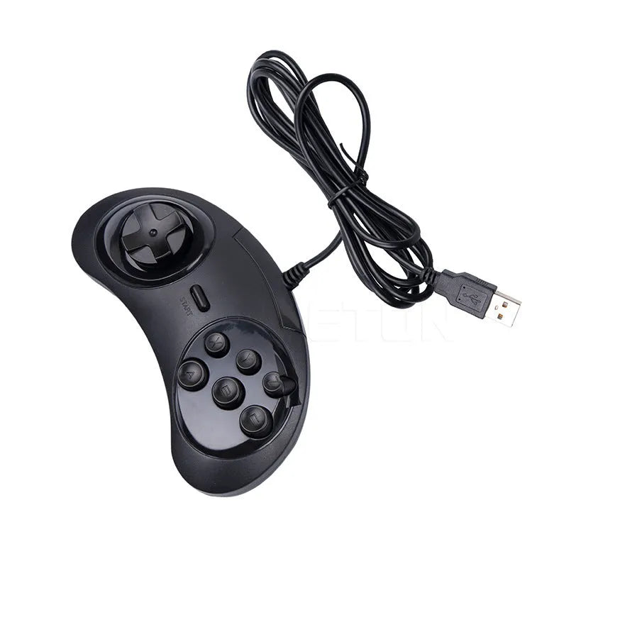 Black Sega USB wired PC game controller with 1.8-metre cable next to a computer.