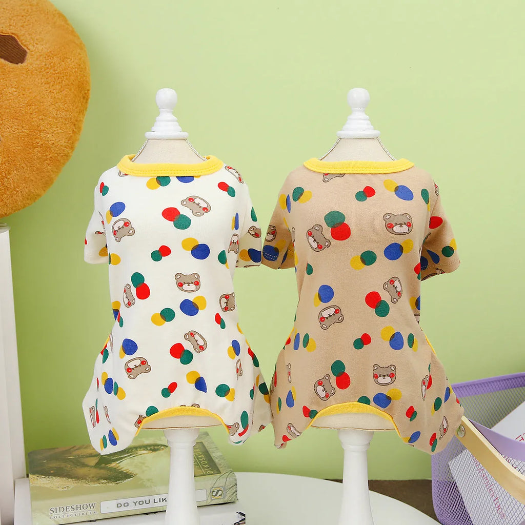 Beige dog jumper with colourful ball bear print, shown on a dog, made from cotton and spandex blend.