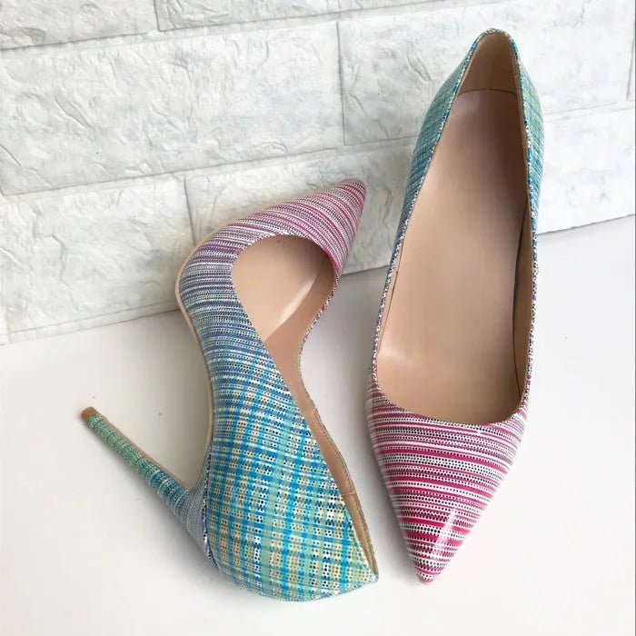 A pair of women's pink and blue gradient patent leather high heel shoes with a pointed toe.