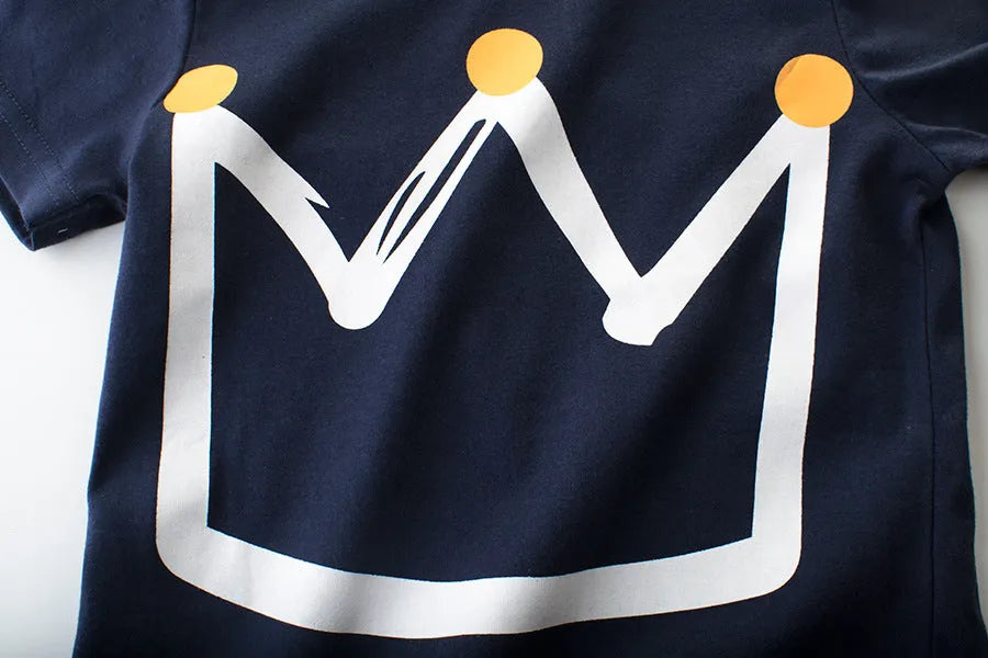 Boys' royal blue short sleeve cotton T-shirt shown on a hanger.