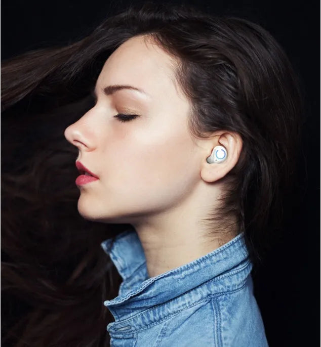Black and white M18 true wireless Bluetooth in-ear headset with charging case.