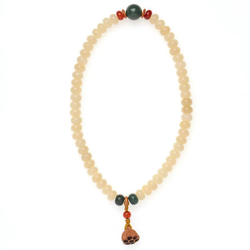 Wooden bracelet with flat round cream topaz beads for a 15-20cm wrist.