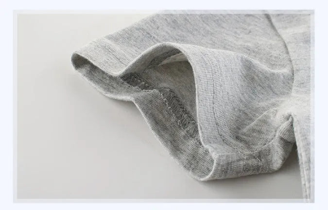 Grey children's cotton T-shirt laid flat, showing a size chart for measurements from 90cm to 140cm.