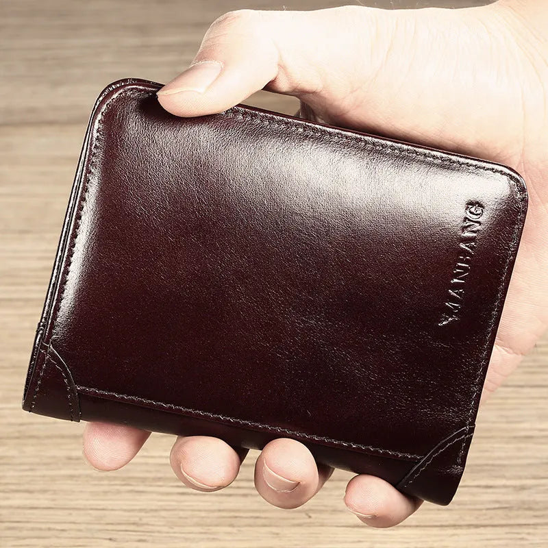 Men's black leather bifold RFID wallet open to show card slots, ID window, coin pouch, and banknote compartment.