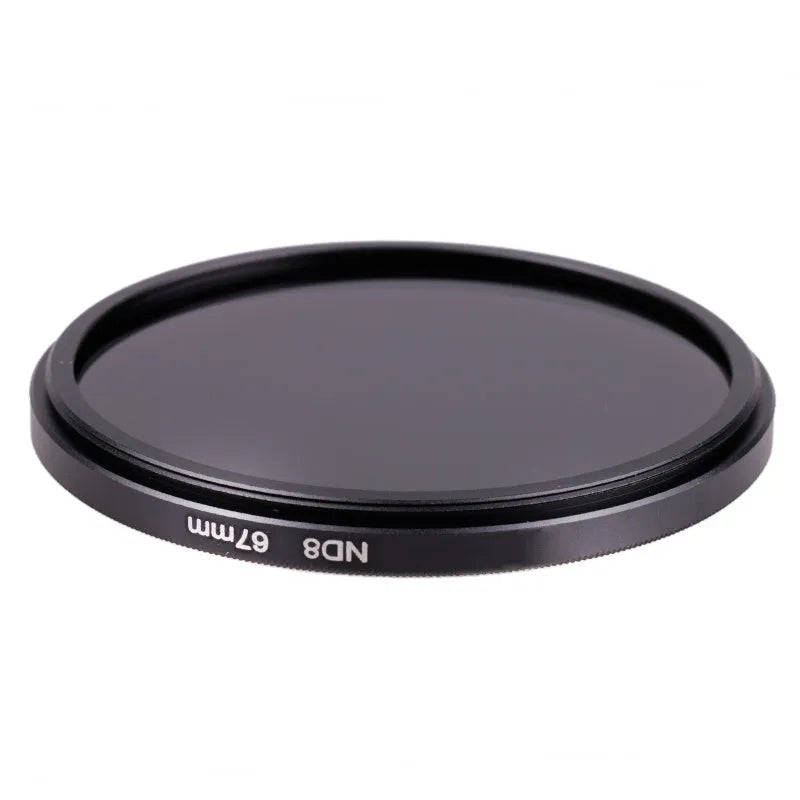 ND8 neutral density camera filter with aviation aluminium frame shown next to a lens.