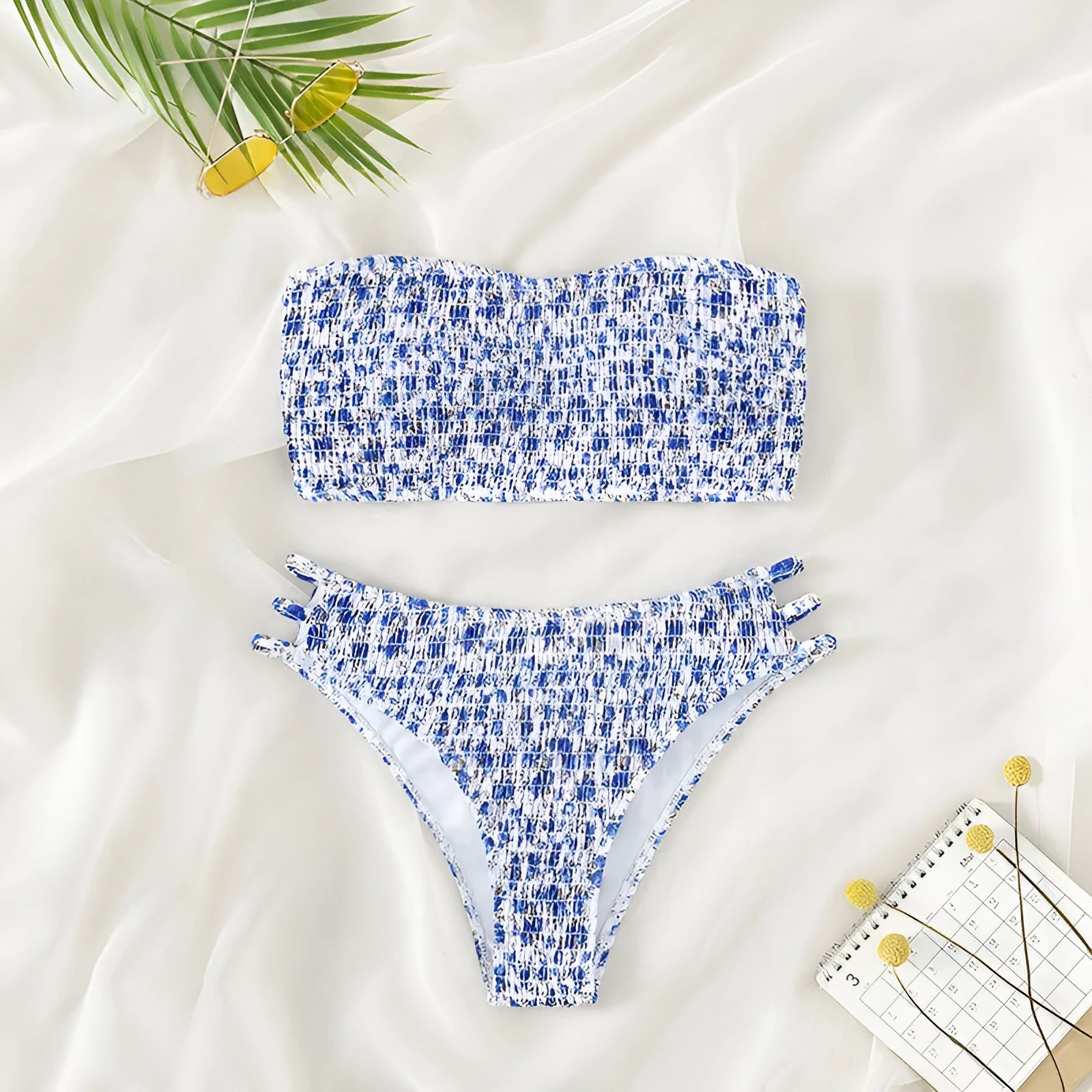 Women's strapless floral bikini set with high-waisted briefs on a white background